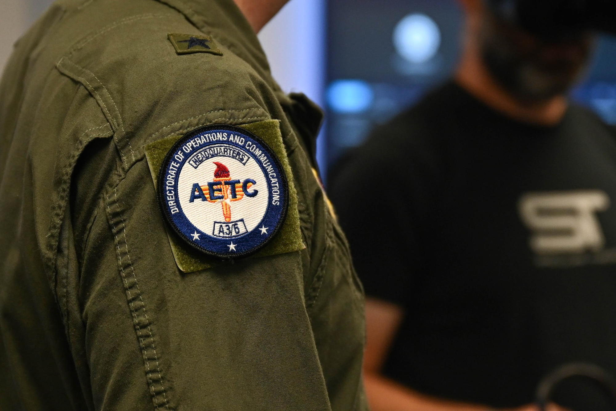U.S. Air Force Brig. Gen. Jeffery Nelson, director of operations and communications for Air Education and Training Command (AETC), displays an AETC patch at Altus Air Force Base, Oklahoma, June 9, 2025. As part of Headquarters AETC, Nelson is responsible for the world's largest training organization, providing initial skills and supplemental training for over 300,000 Air Force, joint, and international personnel at 65 Air Force and Department of Defense locations. (U.S. Air Force photo by Airman 1st Class Lauen Torres)