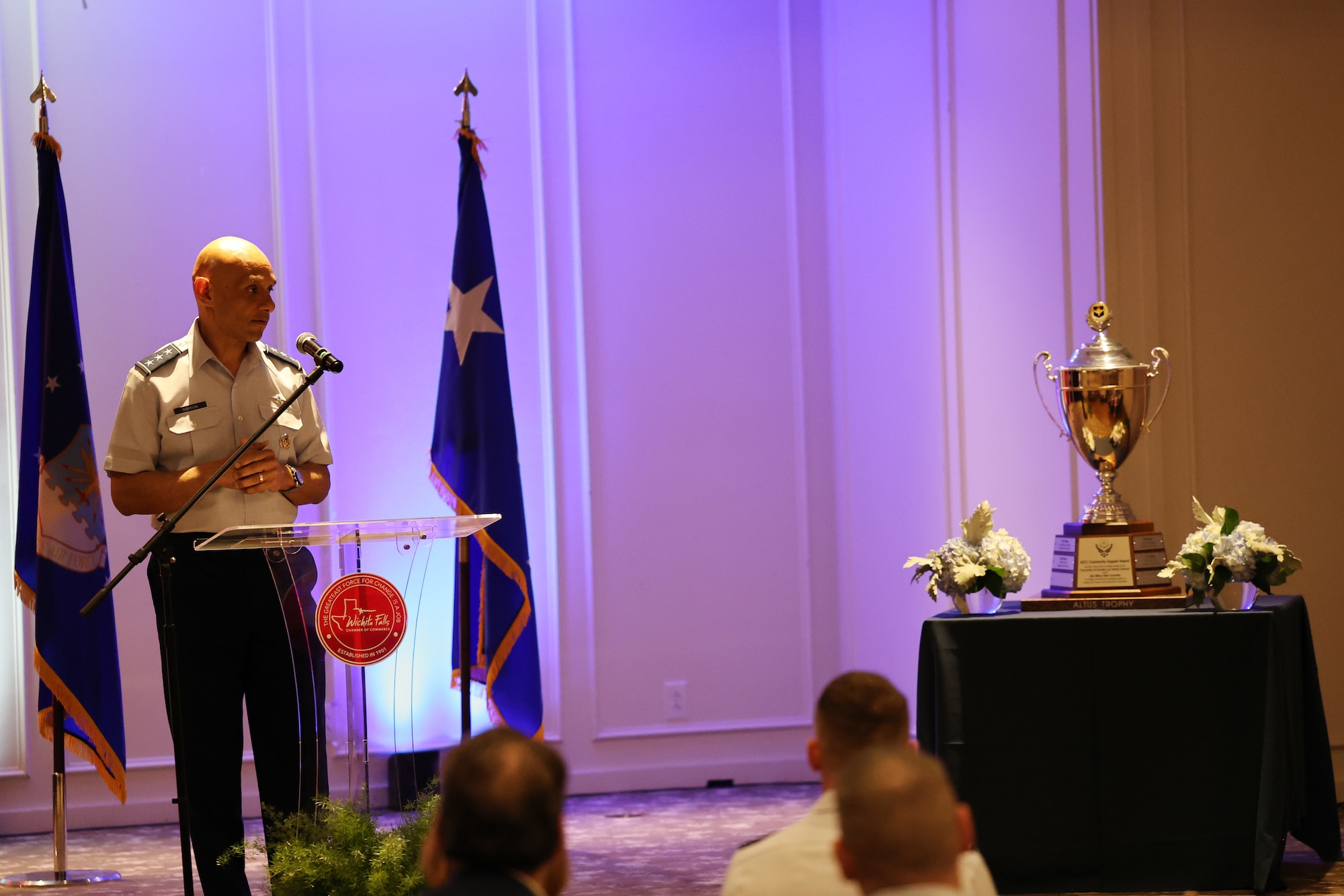 U.S. Air Force Lt. Gen. Brian S. Robinson gives remarks during the Altus Trophy presentation