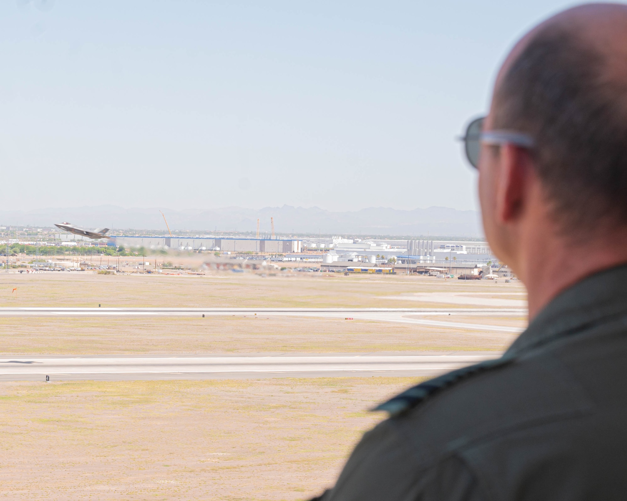 Belgian Chief of Defense Gen. Frederick Vansina, watches an F-35A Lightning II take off from the air traffic control tower.
