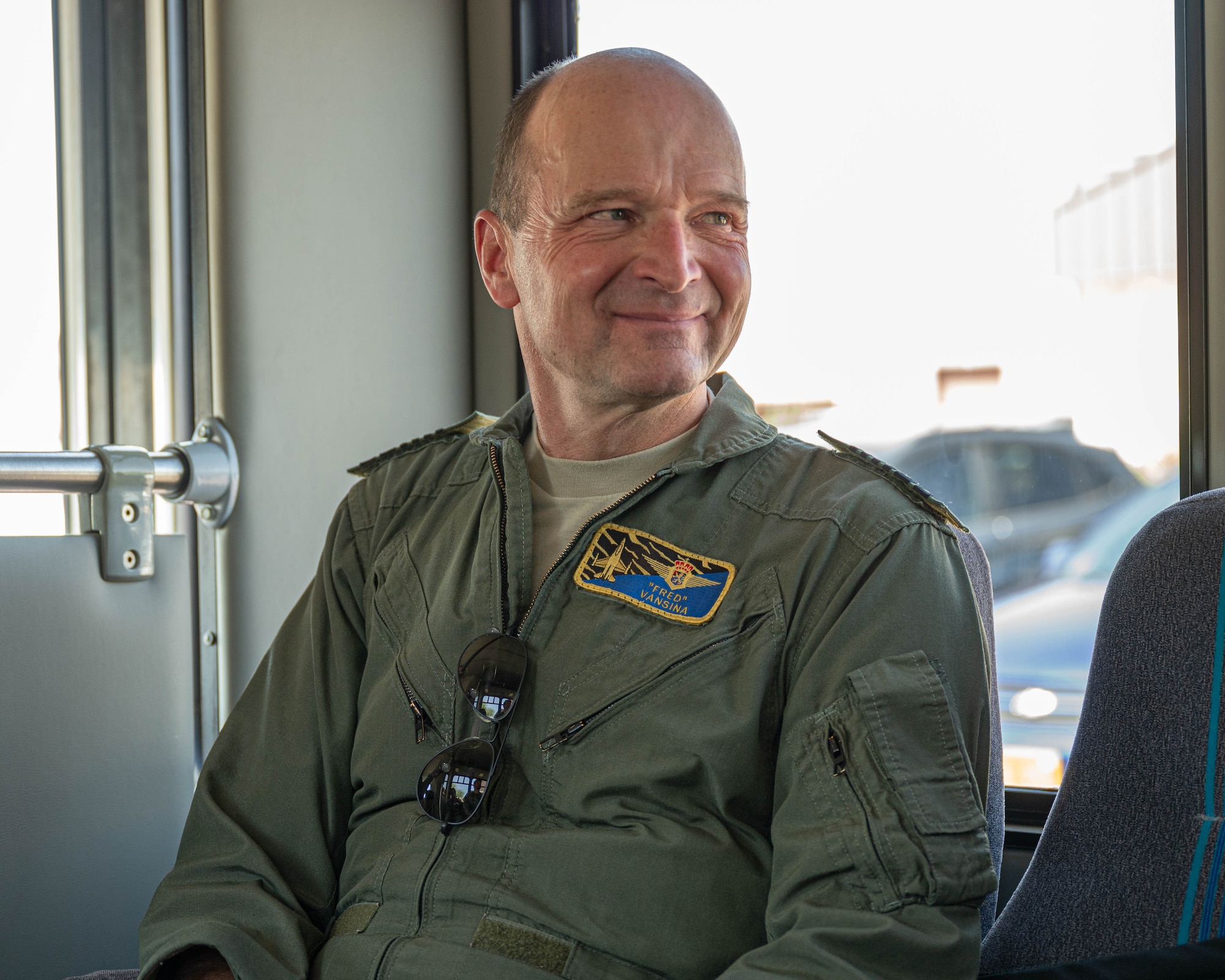 Belgian Chief of Defense Gen. Frederick Vansina, smiles while engaging with personnel.