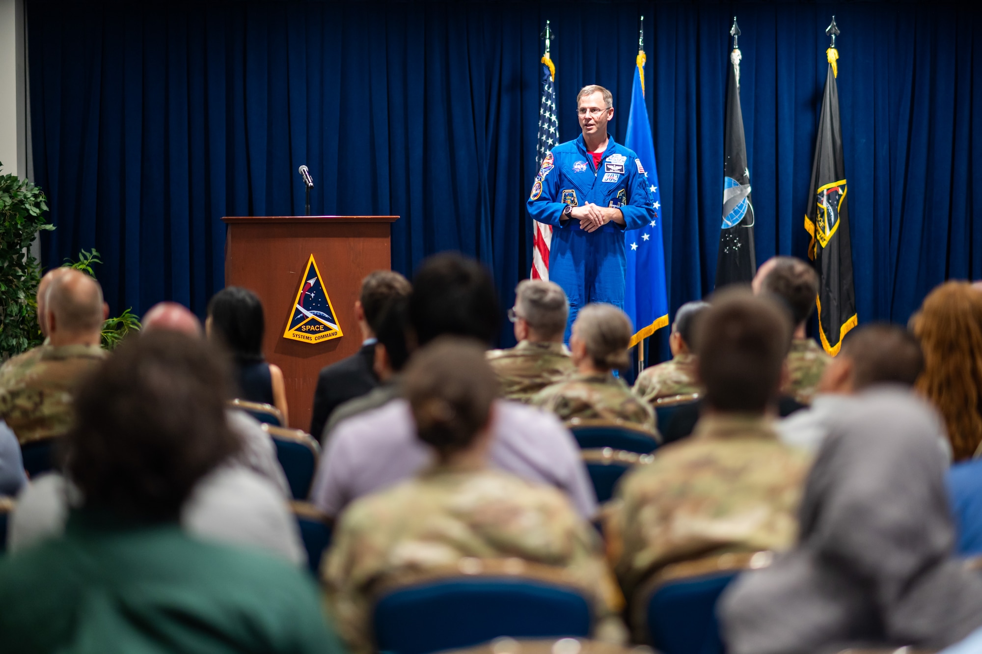 U.S. Space Force Guardian and National Aeronautics and Space Administration Astronaut, Col. Nick Hague, speaks to Space Systems Command personnel during a visit to Los Angeles Air Force Base, El Segundo, Calif., June 16, 2025. Hague, the first USSF Guardian to be launched into space as part of the NASA Astronaut program on the SpaceX Crew-9 mission, shared his perspective and experience highlighting the important role SSC Guardians play in securing advantages in the “ultimate high ground” which ensures agencies like NASA can continue their mission and exploration of the domain.