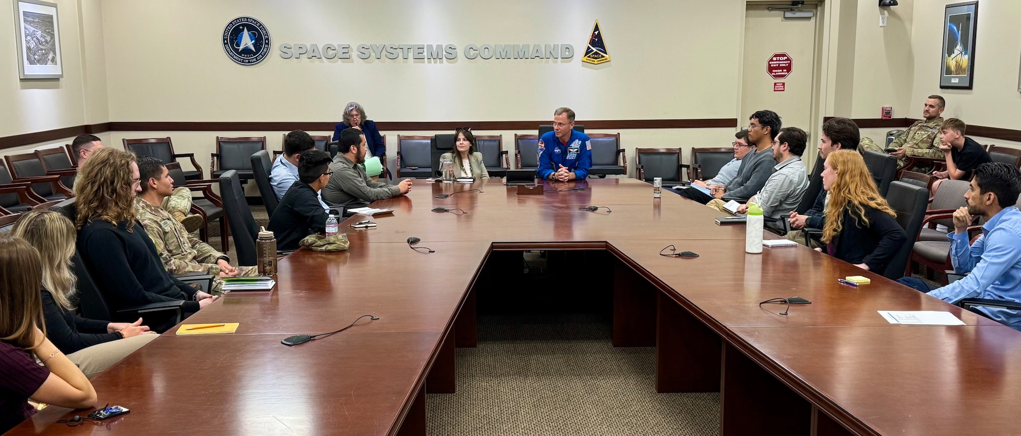 U.S. Space Force Guardian and National Aeronautics and Space Administration Astronaut, Col. Nick Hague, speaks to interns in Space Systems Command Science Technology Engineering and Mathematics (STEM) program during a visit to Los Angeles Air Force Base, El Segundo, Calif., June 16, 2025. Hague’s mentorship opportunity with the interns included perspective on the importance of “soft skills,” including small team dynamics, and how cultivating those skillsets is not only a part of how NASA Astronauts are selected and developed throughout the program, but also a key component to success in the USSF.