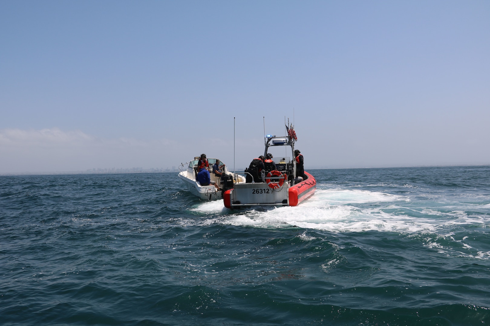 The Coast Guard interdicted 10 aliens aboard a 25-foot white Sea Ray vessel in the vicinity of Point Loma, June 23, 2025.  The Coast Guard maintains a robust presence along the maritime border and works closely with federal partners to detect, deter, and disrupt illegal maritime migration ventures. (U.S. Coast Guard photo courtesy of CGC Benjamin Bottoms/released).