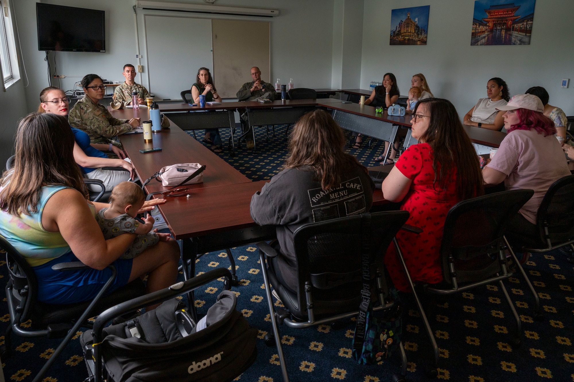 Spouses of Yokota engage in conversation during a spouse coffee chat.