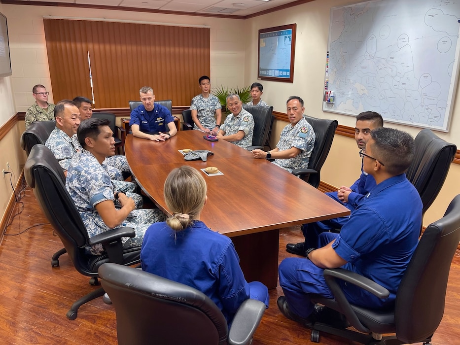 Cmdr. Patton Epperson, acting deputy commander of U.S. Coast Guard Forces Micronesia/Sector Guam, alongside Deputy Commander Singapore Naval Diving Unit Lt. Col. Brandon Choo, lead a discussion on shared challenges, interoperability, and strategies to advance maritime security in the Pacific in Guam on June 11, 2025.