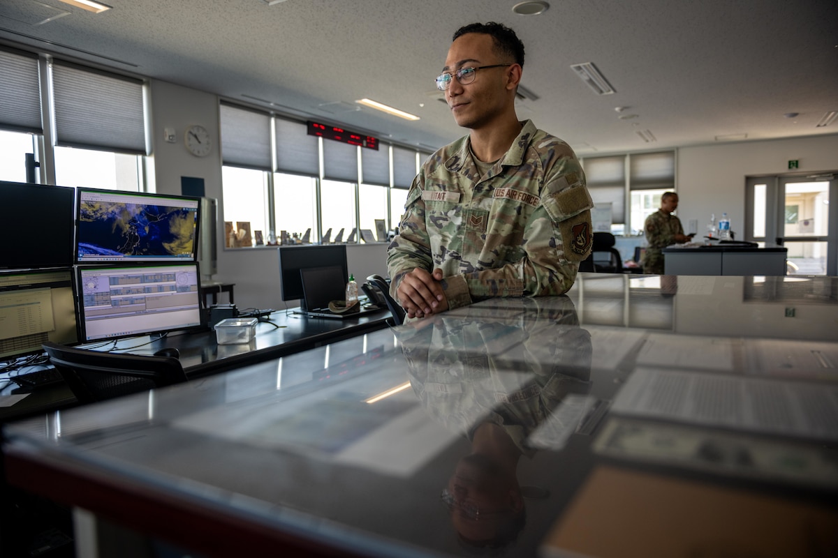 U.S. Air Force Staff Sgt. Elijah Tait, 35th Operations Support Squadron (OSS) weather operations and planning noncommissioned officer in charge, delegates mission duties for the day to weather forecasters.