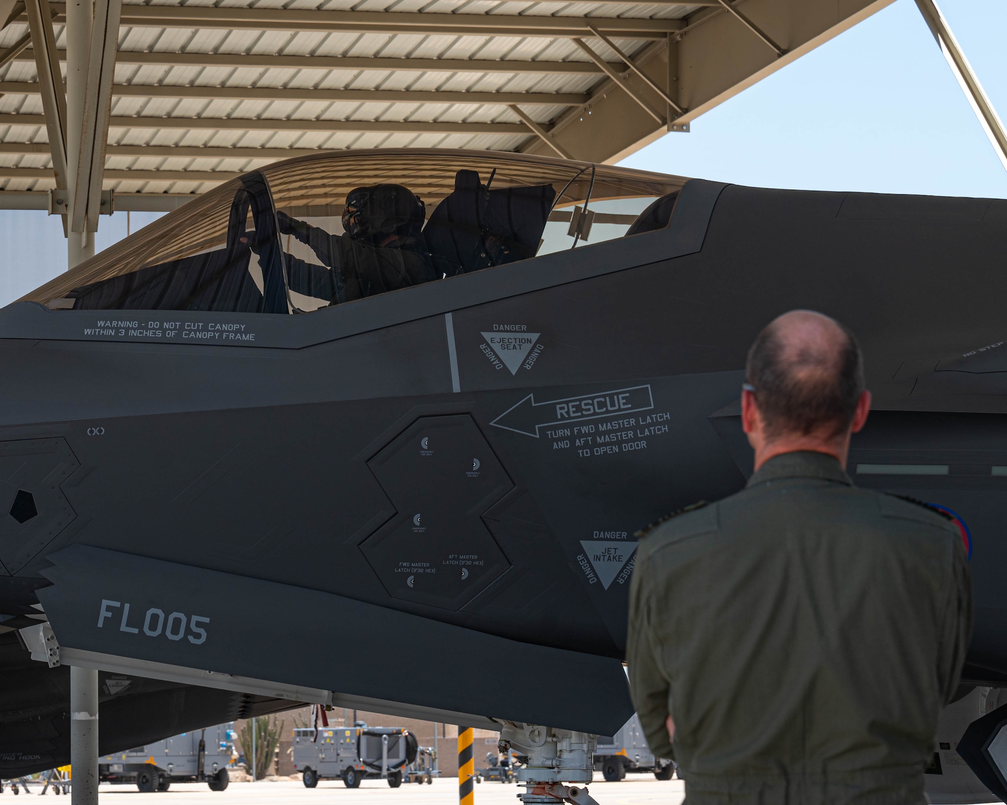 Belgian Chief of Defense Gen. Frederick Vansina, watches an F-35A Lightning II land,