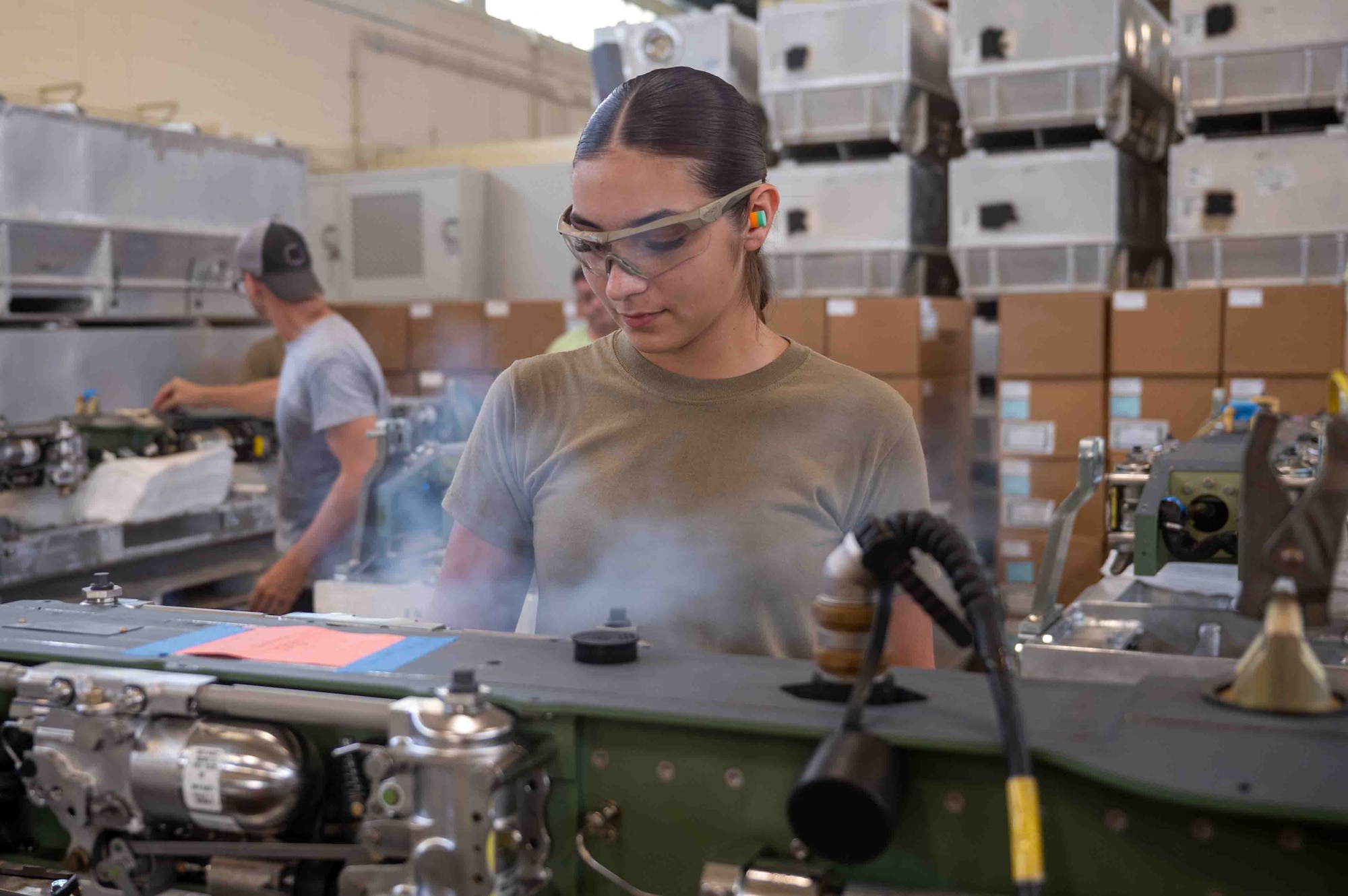service member works on machine