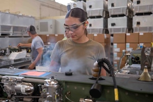 service member works on machine
