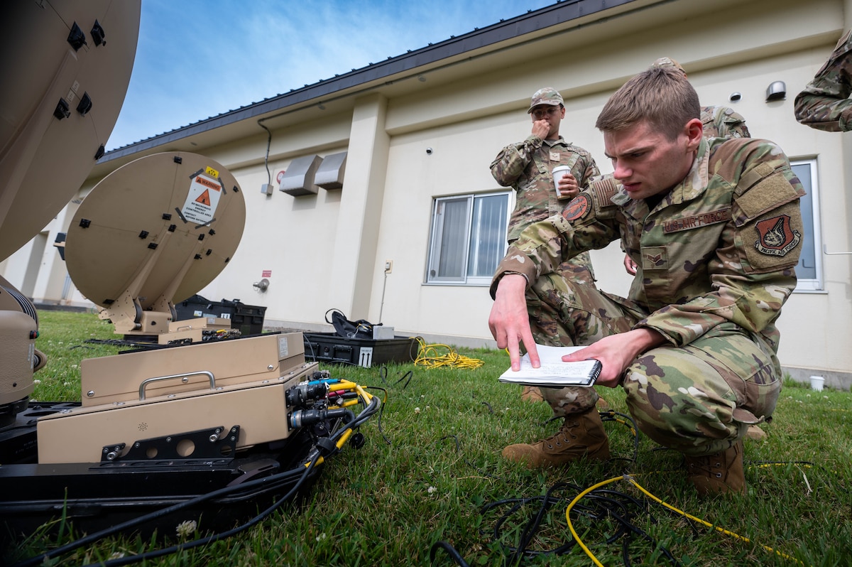U.S. Air Force Senior Airman Aaron Dirig, 35th Communications Squadron expeditionary communications noncommissioned officer in charge, ensures the operability of a Hawkeye III Lite satellite system Rapid Response Communications Kit at Misawa Air Base, Japan, June 24, 2025.