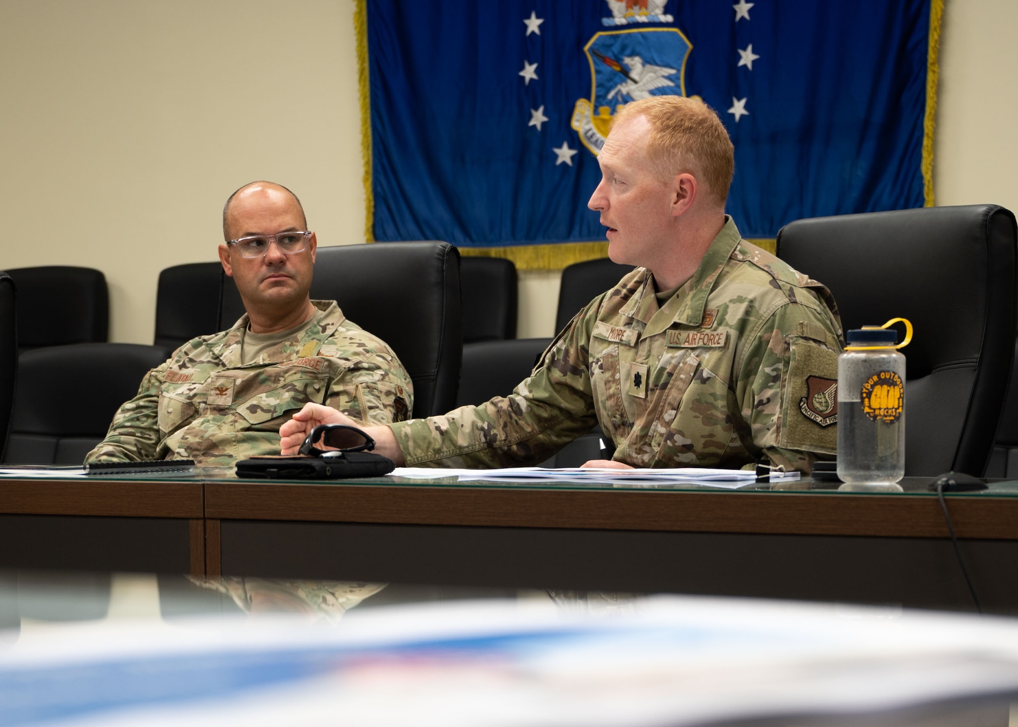 U.S. Air Force Col. Philip Flatau, left, 51st Medical Group deputy commander watches as U.S. Air Force Lt. Col. Brigham Moore, right, 51st Civil Engineer Squadron deputy commander, briefs during the Osan 2035 Installation Development Plan board .