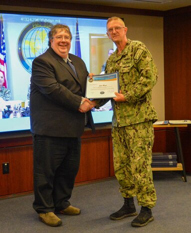 John Moyer Jr. Shakes Hands with Vice Adm. Johnny Wolfe Jr., Director for Strategic Systems Programs, after being presented with the 2025 SSP Influencer Award on June 4, 2025.
