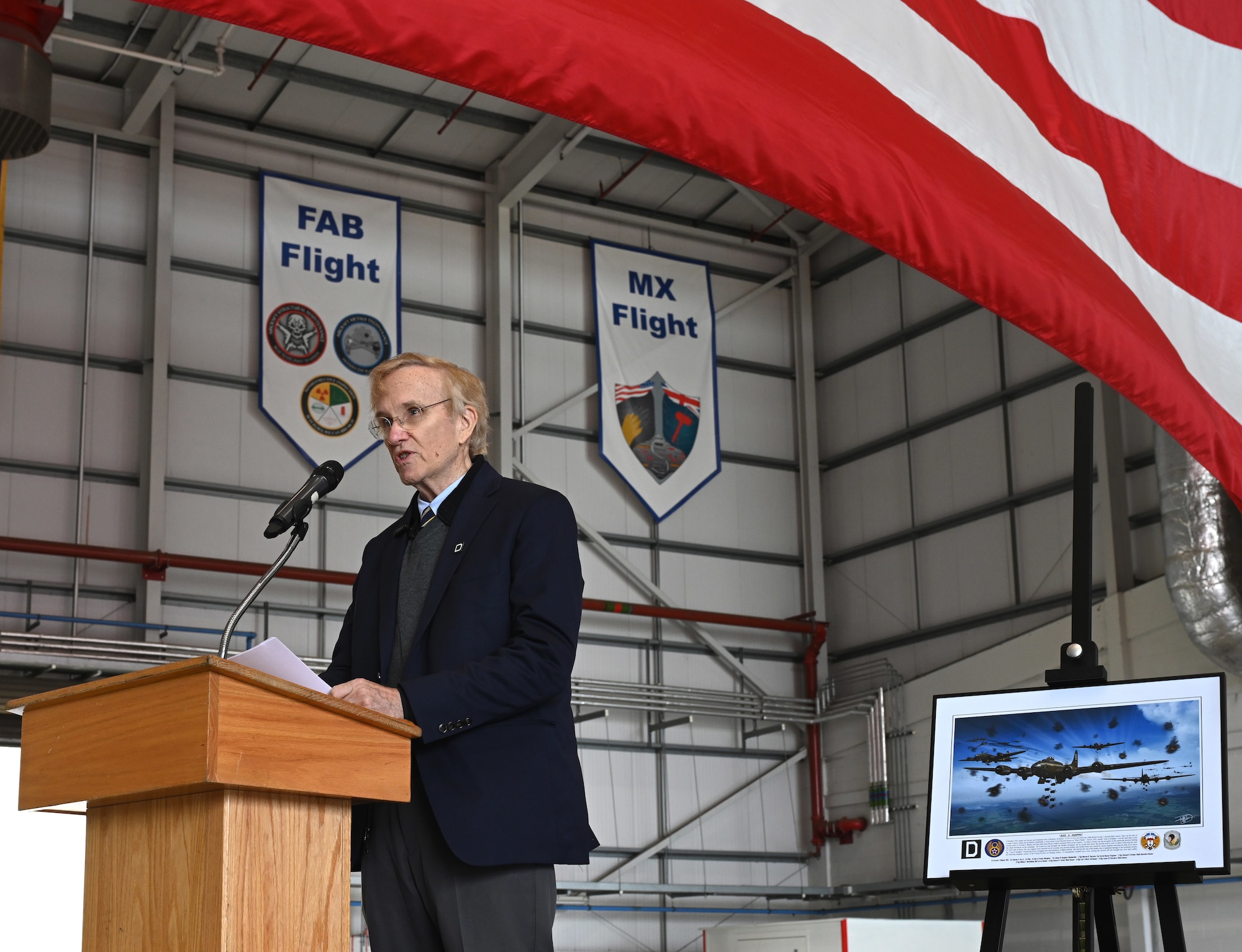 Jim Blakely, son of then-1st Lt. Everett Blakely, World War II and 100th Bomb Group B-17 Flying Fortress pilot, shares memories of his father and his missions flown during World War II at a nose art unveiling ceremony at RAF Mildenhall, England, June 9, 2025. The nose art, designed by Gary Rogers, 100th Air Refueling Wing Public Affairs graphic designer, pays tribute the aircrew who flew together on the B-17 Flying Fortress, “Just-A-Snappin,” on the Bremen mission over Germany in October 1943. (U.S. Air Force photo by Karen Abeyasekere)