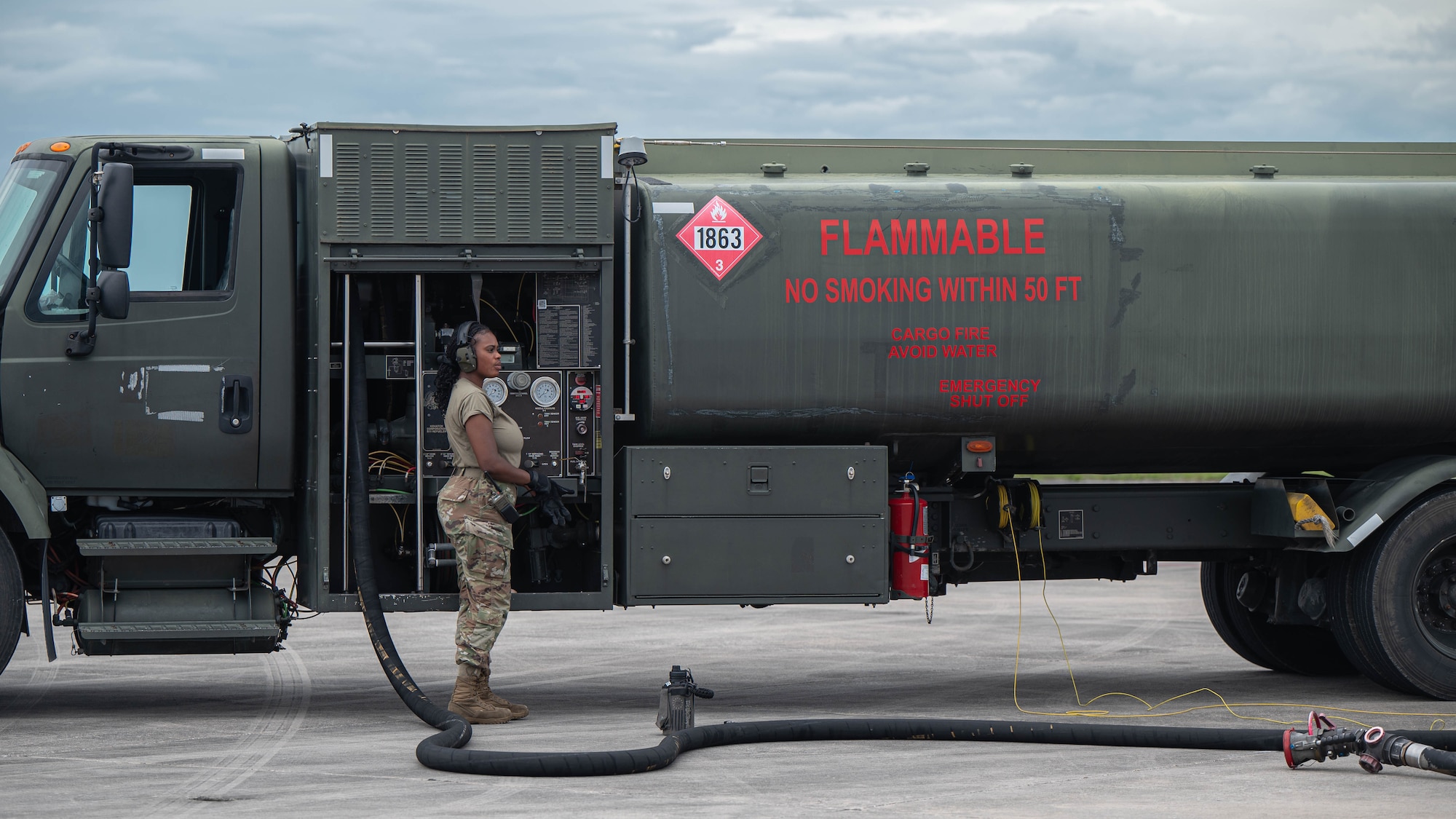 An Airmen observes as fuel is reloaded into an F-35