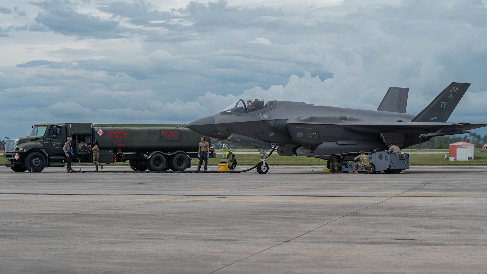Airmen from the 325th FW load fuel and weapons for an F-35