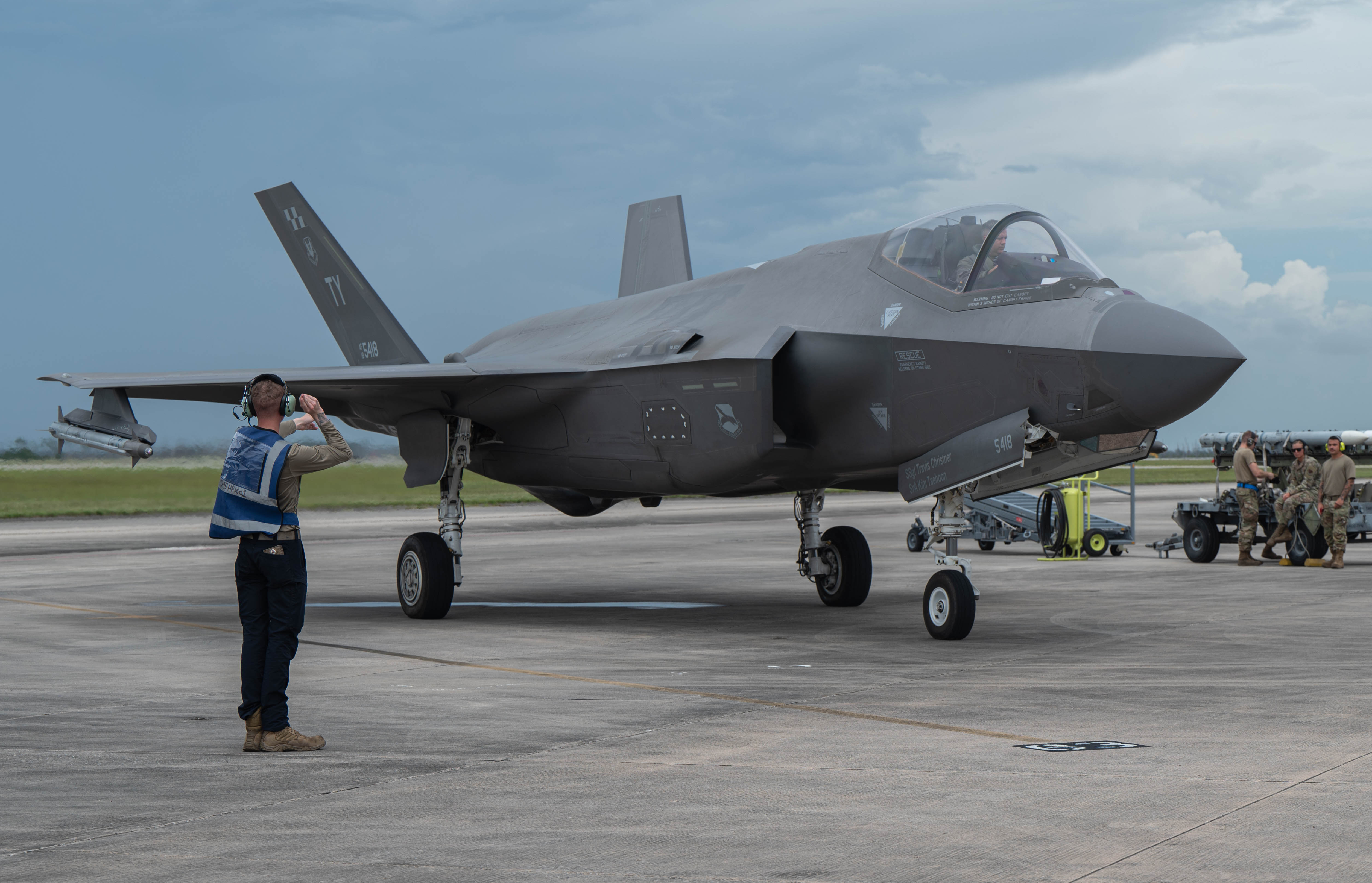 Picture of maintainer marshalling an F-35A