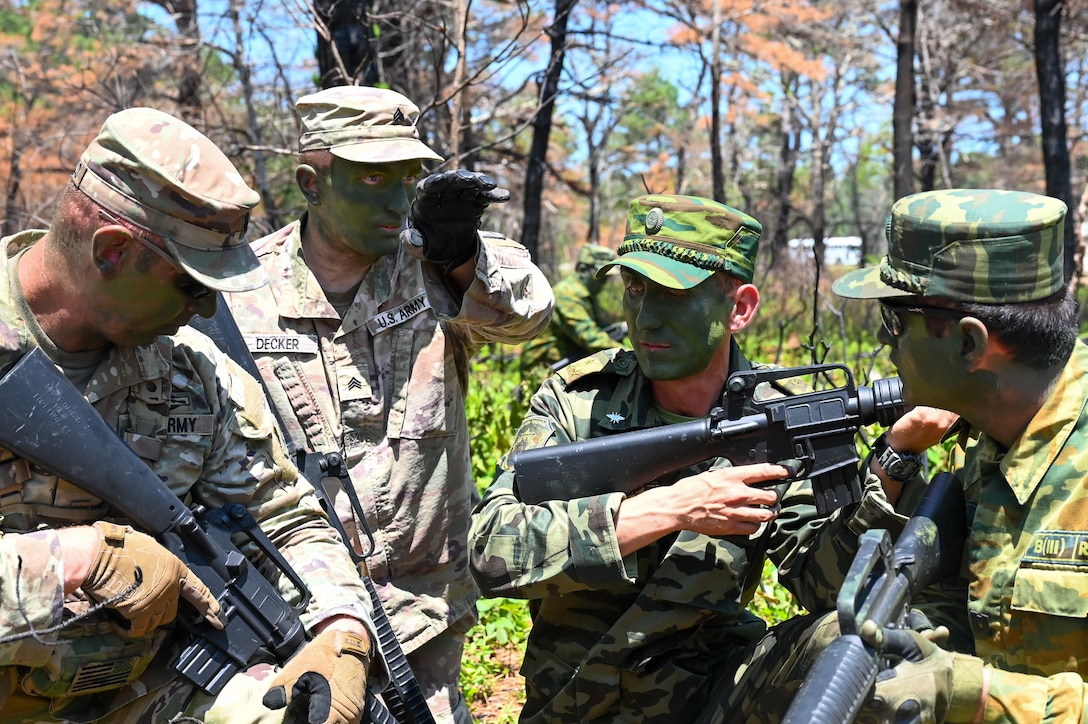 Tajikistan and U.S. Army soldiers coordinate training formations at Joint Base Cape Cod, Massachusetts, June 21, 2025 during exercise Regional Cooperation 25. Regional Cooperation 25 is an annual, multinational U.S. Central Command sponsored command-post and field training exercise conducted by National Guard units in partnership with Central and South Asia nations. (U.S. Air Force photo by Staff Sgt. Colten Tessness)