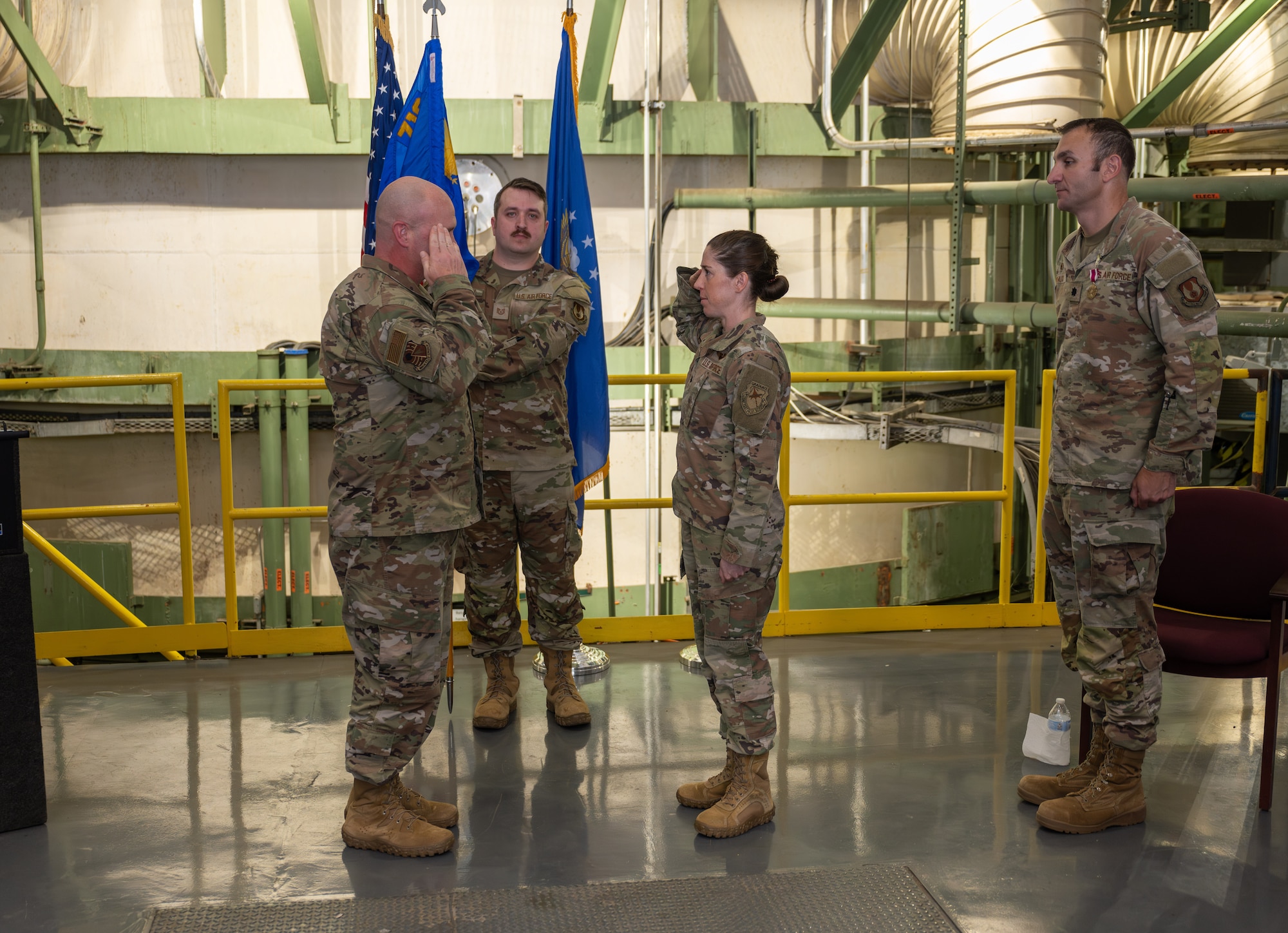 Lt. Col. Rachel Chrash, second from right, and 804th Test Group Commander Col. Jason Vap, left, exchange salutes as Chrash assumes command of the 718th Test Squadron during a Change of Command ceremony, June 18, 2025, at Arnold Air Force Base, Tenn., headquarters of Arnold Engineering Development Complex. Also pictured are outgoing 718 TS commander Lt. Col. Bradley Breaux, right, and Tech. Sgt. Abel Crowell. (U.S. Air Force photo by Keith Thornburgh)