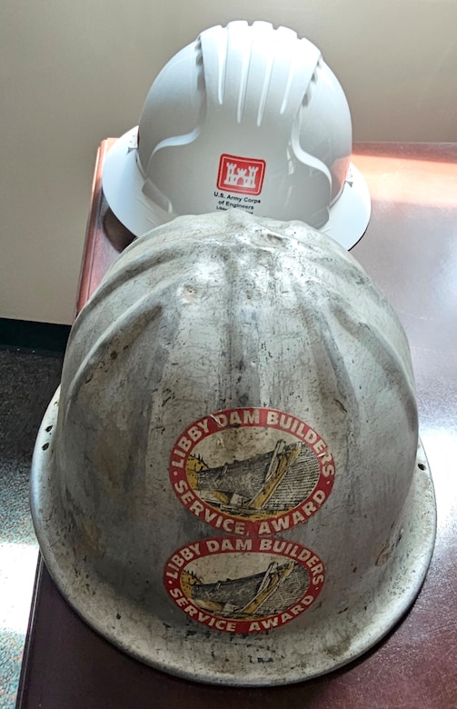Hard hats worn by Tana Wilson, natural resource manager at Libby Dam, and one of her grandfathers during the dam’s construction in the 1960s. At 422 feet tall, Libby Dam holds back the waters of the Kootenai River to form the 90-mile-long Lake Koocanusa reservoir, 42 miles of which are is in Canada.  (Photo courtesy Tana Wilson)