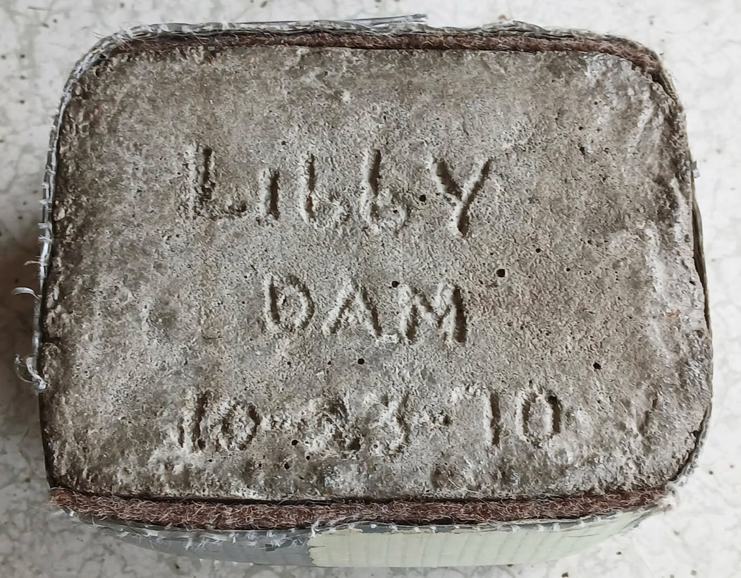 Libby Dam Natural Resource Manager Tana Wilson's paternal grandfather, Grandpa Whitey, saved a core sample, etched with the words "Libby Dam" and used it as a door stopper for his home's backdoor that lead to the yard. Both Wilson's grandfathers worked on the construction of the dam in the 1960s, and saved mementos of their times on the project, commemorating the families' contributions to the dam, and the Libby community at large. (Photo courtesy Tana Wilson)