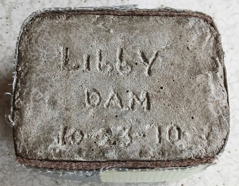Libby Dam Natural Resource Manager Tana Wilson's paternal grandfather, Grandpa Whitey, saved a core sample, etched with the words "Libby Dam" and used it as a door stopper for his home's backdoor that lead to the yard. Both Wilson's grandfathers worked on the construction of the dam in the 1960s, and saved mementos of their times on the project, commemorating the families' contributions to the dam, and the Libby community at large. (Photo courtesy Tana Wilson)