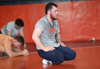 Spc. Joe Braunagel pauses for a moment during wrestling practice at the University of Illinois Urbana-Champaign, June 17, 2025.