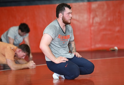 Spc. Joe Braunagel pauses for a moment during wrestling practice at the University of Illinois Urbana-Champaign, June 17, 2025.