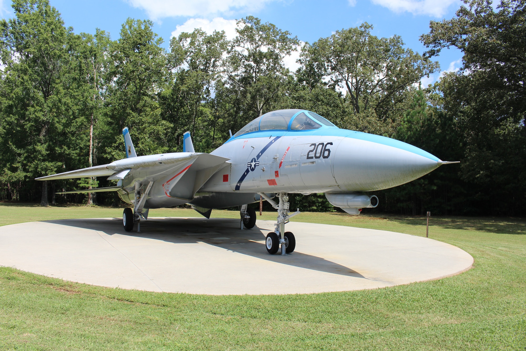 The static F-14 Tomcat on display outside the Main Gate at Arnold Air Force Base, Tenn., is dedicated to Navy Lt. Kara Hultgreen. Hultgreen was the first female carrier-based combat fighter pilot in the U.S. Navy and the first female fighter pilot in the U.S. military to die in a crash. She died Oct. 25, 1994, when the Tomcat she was piloting experienced engine failure on final approach to an aircraft carrier and crashed into the Pacific Ocean near San Diego, Calif. (U.S. Air Force photo by Kali Bradford)