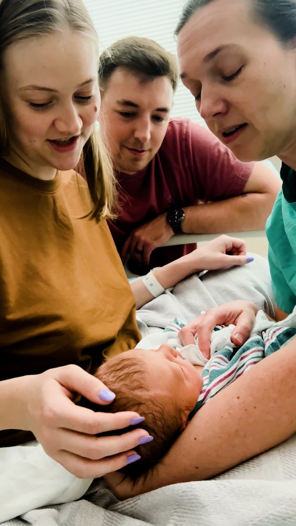 Winn Army Community Hospital midwife Capt. Erin Fallis holds Nathan Hardy during a check-in as mom KaRena and dad Justin look on. The Hardys choose to have their child at Winn after their original plan to give birth at a birthing center fell through. Their experience at Winn gave them the birth they hoped for.
