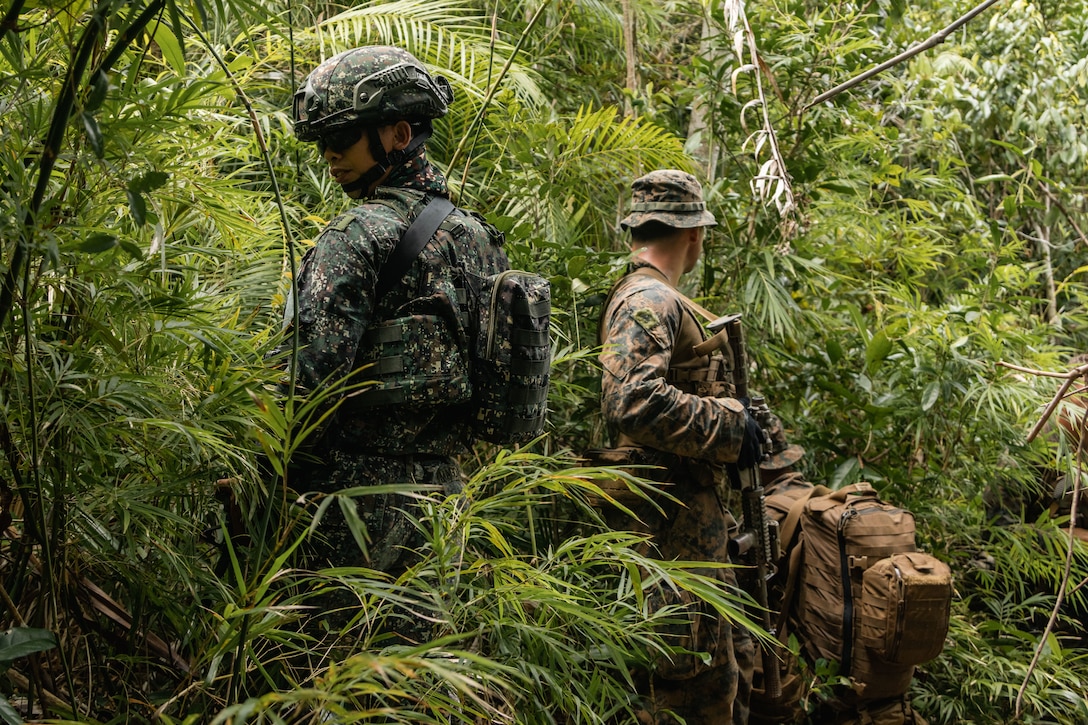 U.S. Marines with 2nd Battalion, 1st Marine Regiment, Marine Rotational Force – Darwin 25.3, I Marine Expeditionary Force Forward, and Philippine Marines with 3rd Brigade set security during KAMANDAG 9 at Oyster Bay, Palawan, Philippines, June 11, 2025. KAMANDAG is an annual Philippine Marine Corps and U.S. Marine Corps-led exercise aimed at enhancing the Armed Forces of the Philippines’ defense and humanitarian capabilities by providing valuable training in combined operations with foreign militaries in the advancement of a Free and Open Indo-Pacific. MRF-D is an annual six-month rotational deployment to enhance interoperability with the Australian Defence Force and allies and partners and provide a forward postured crisis response force in the Indo-Pacific. (U.S. Marine Corps photo by Cpl. Anita Ramos)