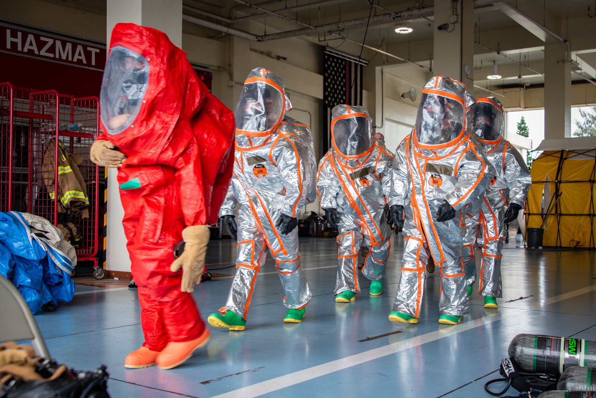 Airman 1st Class Nicholas Garcia, 18th Civil Engineer Squadron, fire and emergency services, leads a group during a joint hazardous materials recertification course at Kadena Air Base, Japan, June 18, 2025. The group also includes U.S. Marines assigned to Camp Foster and Air National Guardsmen assigned to the 134th Civil Engineer Squadron. The exercise fostered interoperability across active-duty, Guard, and Marine Corps emergency response teams. (U.S. Air National Guard photo by Staff Sgt. Jesse Hanson)
