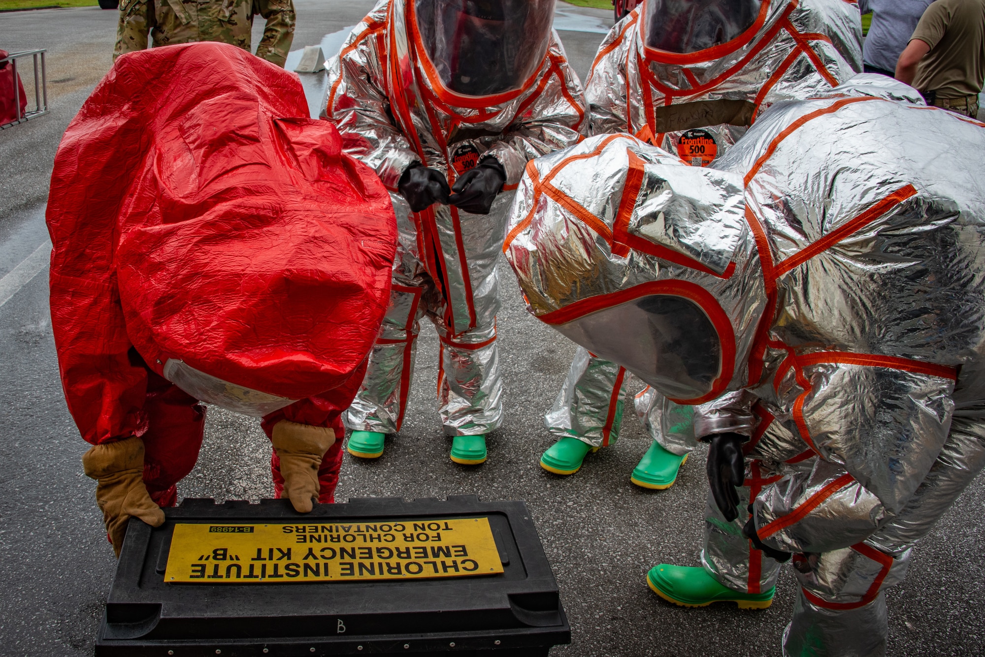 Airman 1st Class Nicholas Garcia, 18th Civil Engineer Squadron, fire and emergency services, opens a Chlorine Institute Emergency Kit B during a joint hazardous materials recertification course at Kadena Air Base, Japan, June 18, 2025. Kit B is used to contain leaks in one-ton chlorine cylinders, commonly found in industrial and municipal settings. (U.S. Air National Guard photo by Staff Sgt. Jesse Hanson)