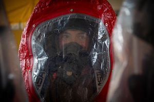 Airman 1st Class Nicholas Garcia, 18th Civil Engineer Squadron, fire and emergency services, wears a hazardous materials suit during a recertification course at Kadena Air Base, Japan, June 18, 2025. The suit provides protection during simulated chemical exposure scenarios to ensure readiness for real-world incidents. (U.S. Air National Guard photo by Staff Sgt. Jesse Hanson)