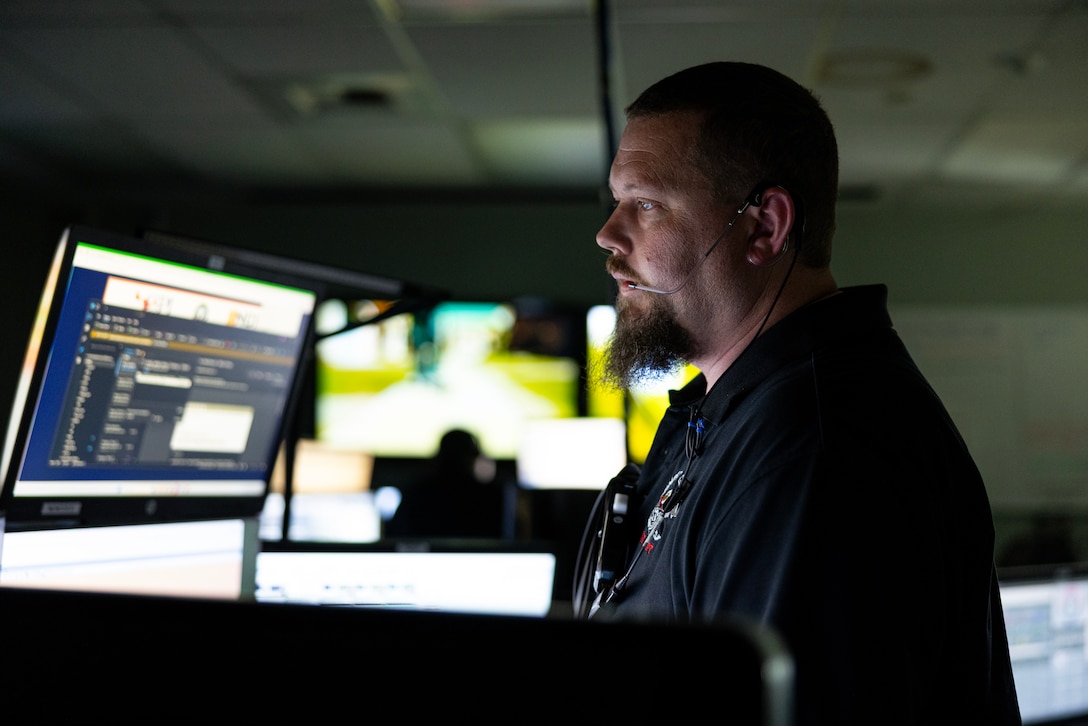 Christopher Burke, a Colorado native, fire dispatcher with Combat Center Fire Department, Marine Air Ground Task Force Training Command, Marine Corps Air Ground Combat Center, responds to a call at MCAGCC, Twentynine Palms, California, June 5, 2025. The Combat Center Fire Department is a community-based organization that aims to provide emergency fire and rescue service, fire prevention program and education, and a fire fighting force capable of handling emergencies, rescues and catastrophes. (U.S. Marine Corps Photo by Lance Cpl. Enge You)