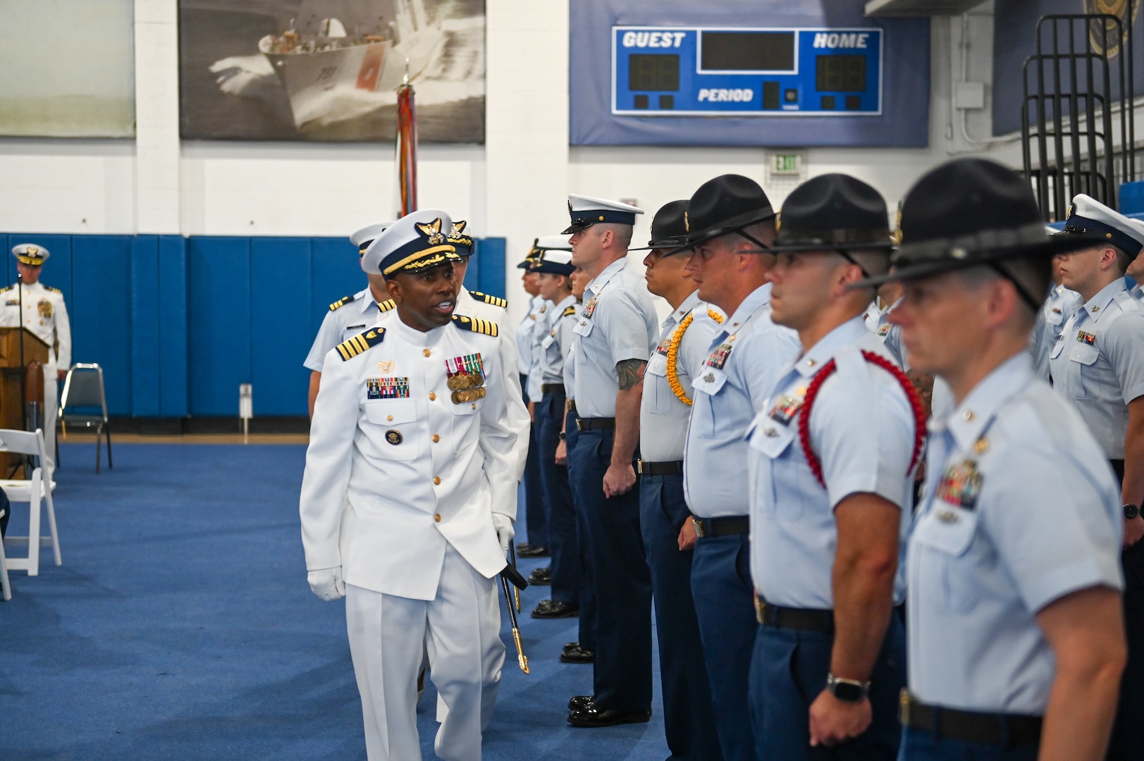 U.S. Coast Guard Capt. Amanda Lee relieved Capt. Warren Judge as Commanding Officer, Training Center Cape May, during an official ceremony on June 24, 2022, in the William Flores Gymnasium at Training Center Cape May, N.J. The change of command ceremony is a time-honored tradition that represents a total transfer of responsibility, authority, and accountability from one officer to another. (U.S. Coast Guard photo by Petty Officer 2nd Class Gregory Schell)