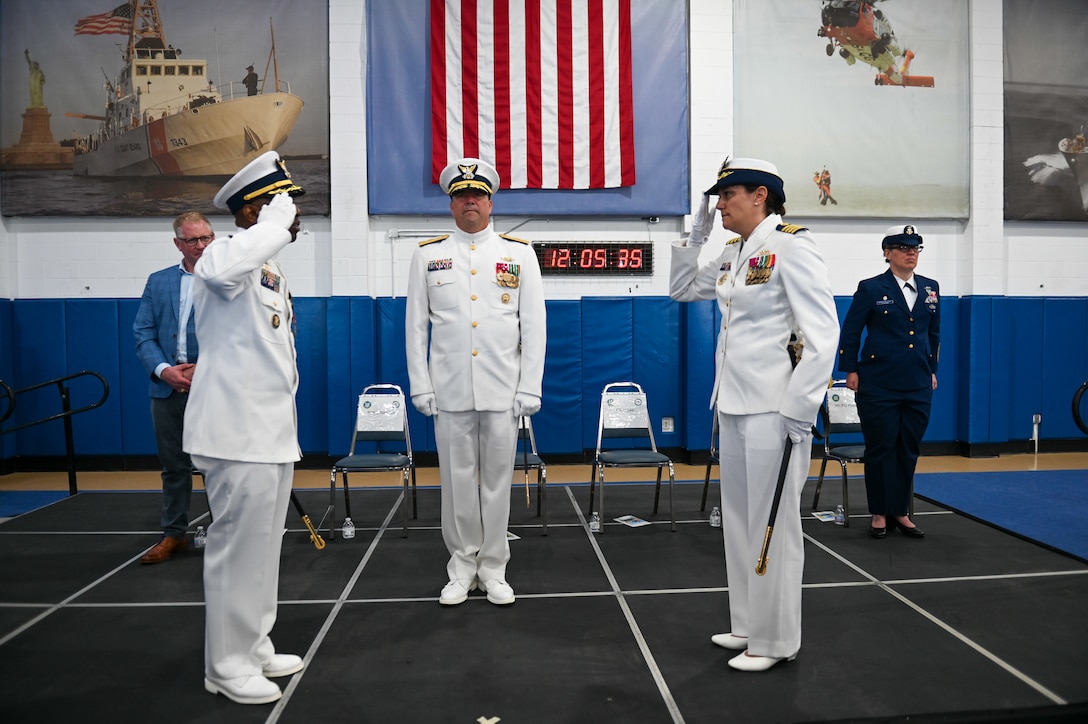 U.S. Coast Guard Capt. Amanda Lee relieved Capt. Warren Judge as Commanding Officer, Training Center Cape May, during an official ceremony on June 24, 2022, in the William Flores Gymnasium at Training Center Cape May, N.J. The change of command ceremony is a time-honored tradition that represents a total transfer of responsibility, authority, and accountability from one officer to another. (U.S. Coast Guard photo by Petty Officer 2nd Class Gregory Schell)
