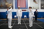 U.S. Coast Guard Capt. Amanda Lee relieved Capt. Warren Judge as Commanding Officer, Training Center Cape May, during an official ceremony on June 24, 2022, in the William Flores Gymnasium at Training Center Cape May, N.J. The change of command ceremony is a time-honored tradition that represents a total transfer of responsibility, authority, and accountability from one officer to another. (U.S. Coast Guard photo by Petty Officer 2nd Class Gregory Schell)