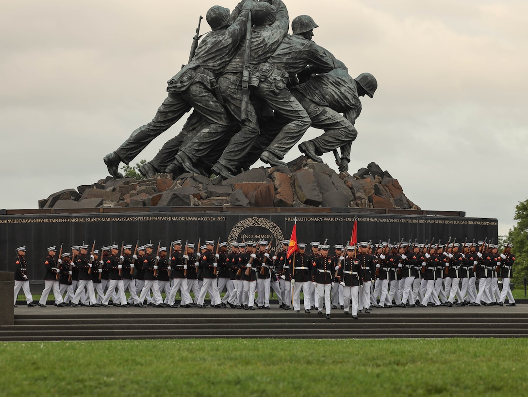 U.S. Marines with Marine Barracks Washington execute “formation of the battalion” during an enlisted Sunset Parade at the U.S. Marine Corps War Memorial in Arlington, Virginia, June 17, 2025. The parade was comprised of entirely enlisted Marines to honor all noncommissioned officers of Marine Barracks Washington and across the Marine Corps. The event was hosted by Sgt. Maj. Carlos A. Ruiz, the 20th Sergeant Major of the Marine Corps, with Sgt. Maj. Justin Lehew (Ret.), a Navy Cross recipient and CEO of History Flight, Inc., serving as the guest of honor. (U.S. Marine Corps photo by Pfc. Brianna Davidson)
