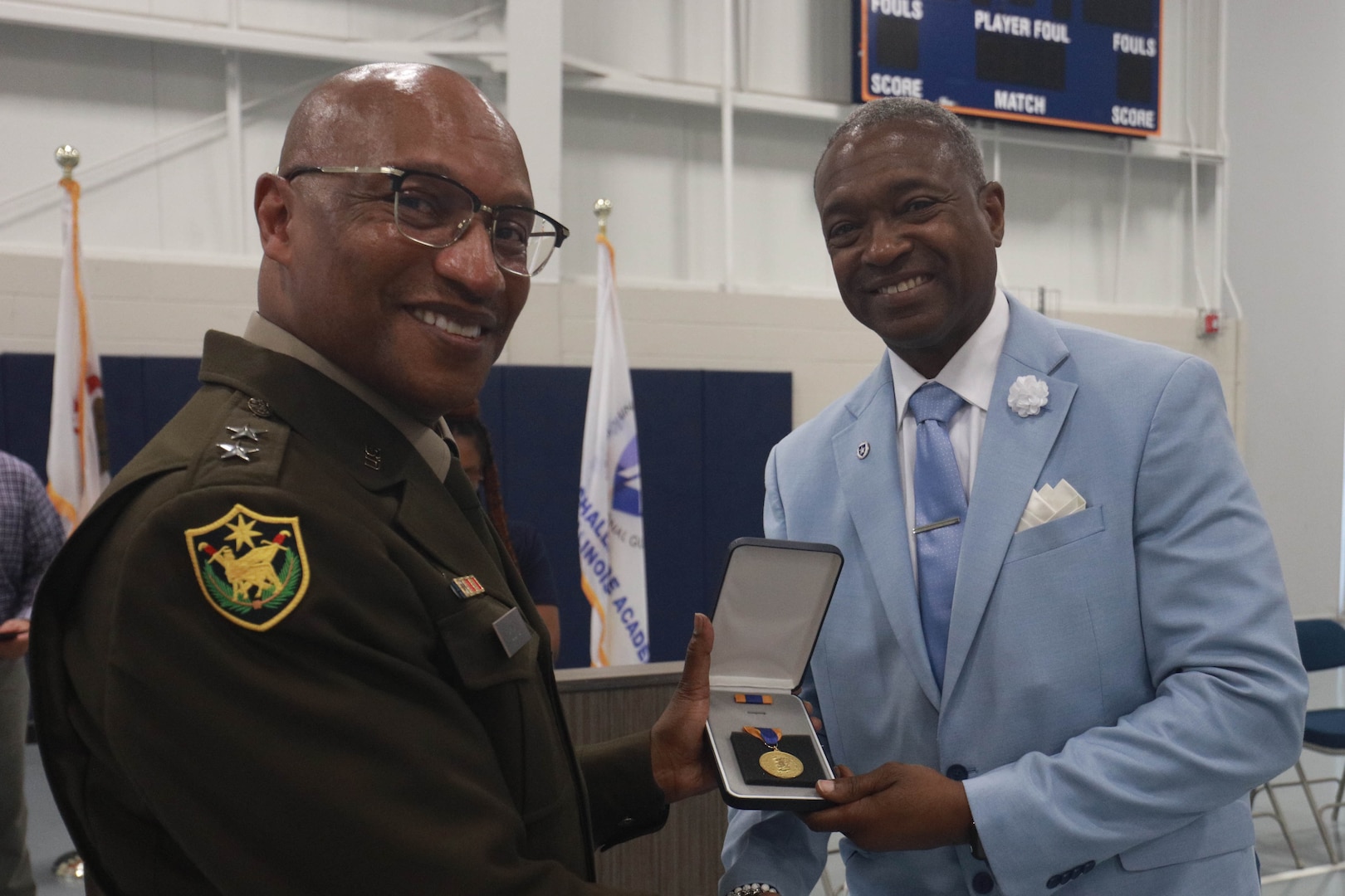 Maj. Gen. Rodney Boyd, the Adjutant General of Illinois and Commander of the Illinois National Guard, awards the Illinois Distinguished Service Medal to Col. (retired) Maurice Rochelle