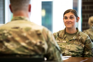 U.S. Air National Guard Staff Sgt. Elizabeth Vann, 134th Air Refueling Wing Finance, listens to a mentor during an event on McGhee Tyson ANGB, June 7, 2025. Senior leaders from the 134th ARW had the opportunity to give one-on-one advice and answer questions from lower enlisted Airmen to help further their career goals and build their social network. (U.S. Air National Guard photo by Senior Airman Ben Cash)