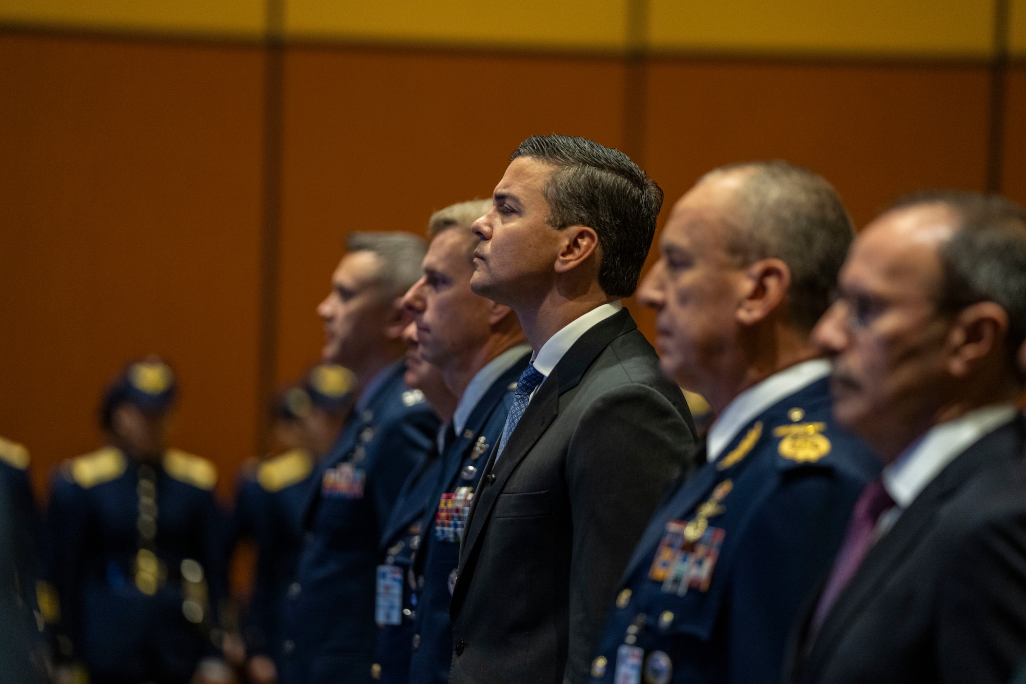 Santiago Peña, President of the Republic of Paraguay, (center), listens to the System of Cooperation Among the American Air Forces (SICOFAA) anthem during the 65th Conference of the American Air Chiefs (CONJEFAMER) meeting in Asuncion, Paraguay, June 18, 2025. CONJEFAMER brought together senior air force leaders and representatives from 21 nations to discuss the collective readiness needs of the Western Hemisphere, align on shared goals and lay the groundwork for future joint exercises. (U.S. Air Force photo by Andrea Jenkins)