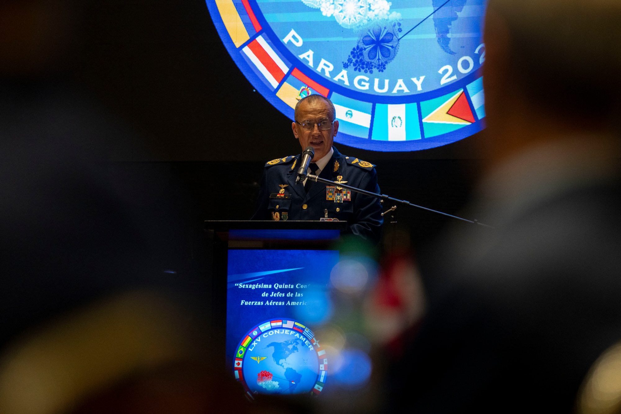 Gen. Julio Rubén Fullaondo Céspede, Paraguayan air force commander, provides remarks during the 65th Conference of the American Air Chiefs (CONJEFAMER) meeting in Asuncion, Paraguay, June 18, 2025. The annual meeting is held to promote and strengthen the bonds of friendship, cooperation and mutual support among its members across the Western Hemisphere. Senior air force leaders and representatives spanning 21 nations took part in discussions concentrated on the collective readiness needs of the Western Hemisphere in order to meet shared visions and lay plans for future exercises. (U.S. Air Force photo by Andrea Jenkins)