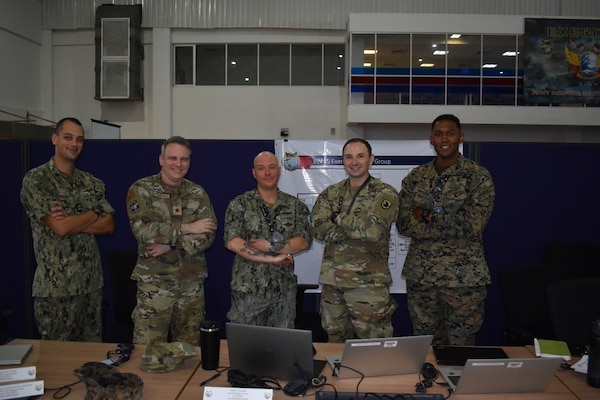 Members of the U.S. Air Force, Navy, Army, and Marine Corps pose for a group photo at the Joint Warfighting Center, Kuantan, Malaysia, June 23, 2025.