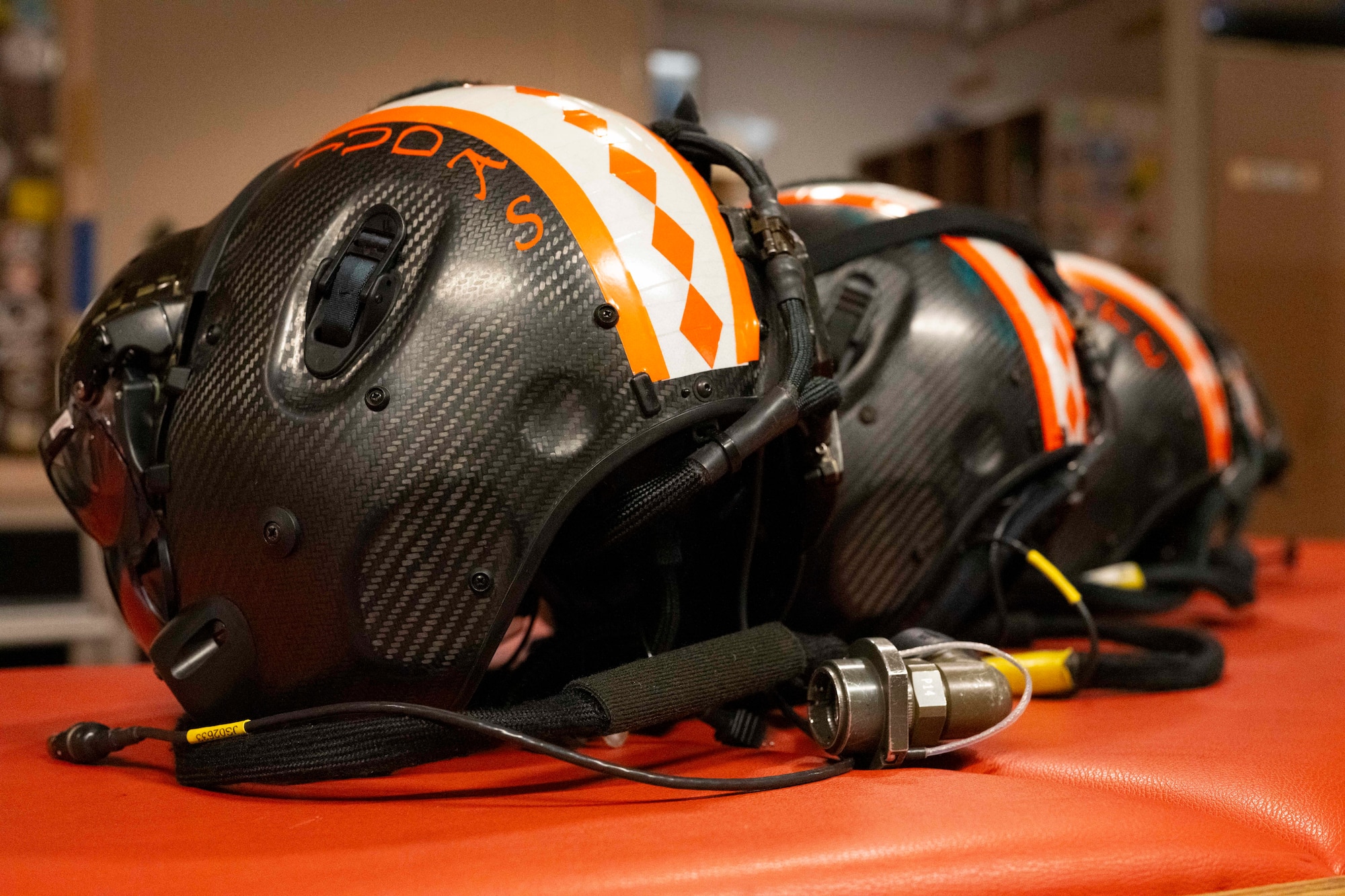 F-35 Lightning II helmets lay on the counter in the Aircrew Flight Equipment office during Red Flag-Alaska 25-2 at Eielson Air Force Base, Alaska, June 16, 2025.