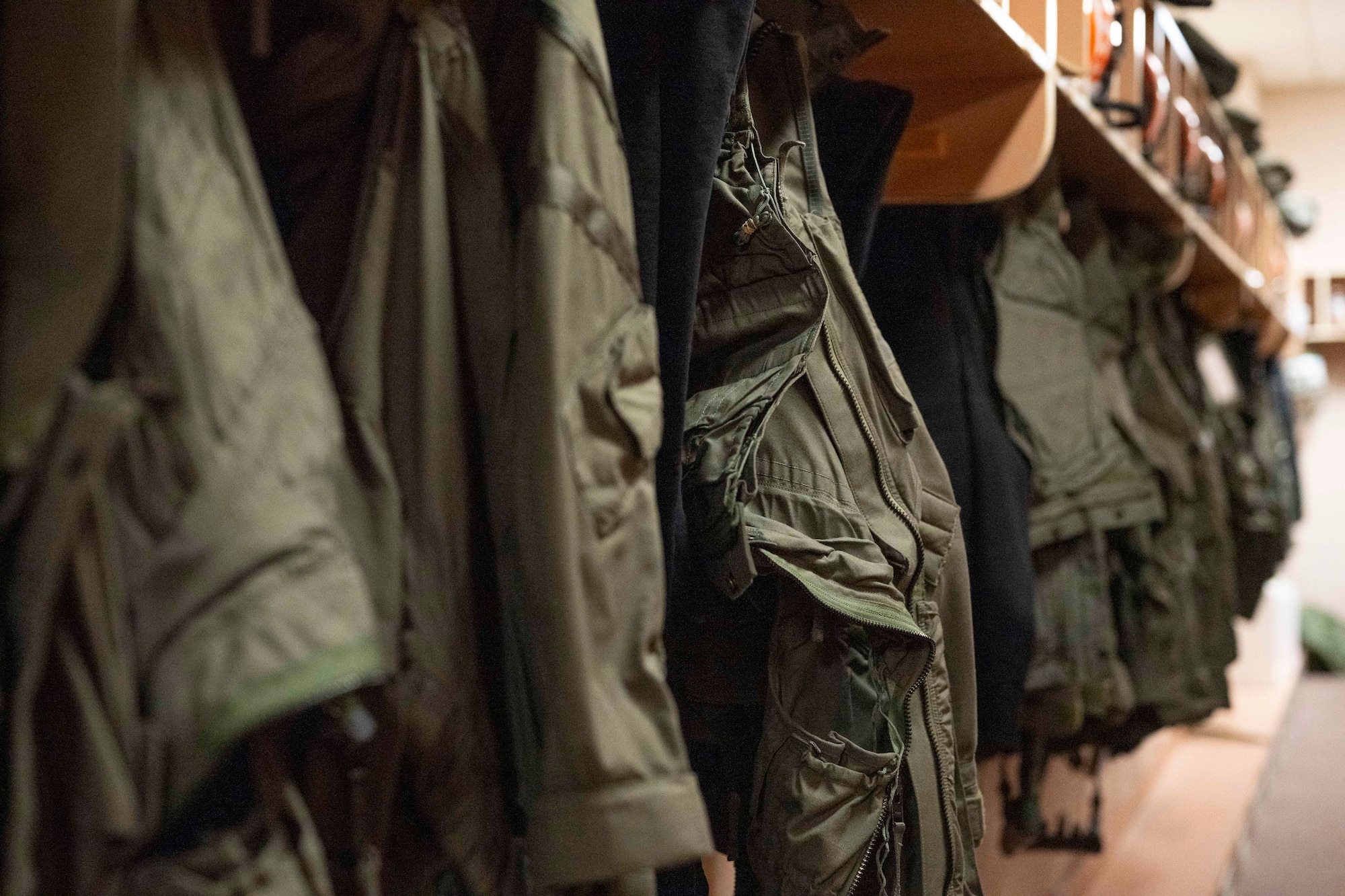 Flight suit equipment hangs on the wall in the Aircrew Flight Equipment office during Red Flag-Alaska 25-2 at Eielson Air Force Base, Alaska, June 16, 2025.