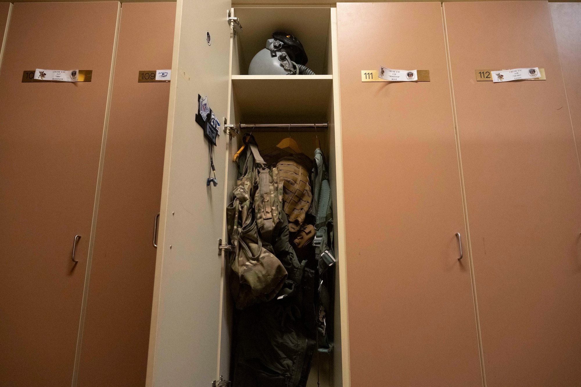 Flight suit equipment sits in a wall locker in the Aircrew Flight Equipment office during Red Flag-Alaska 25-2 at Eielson Air Force Base, Alaska, June 16, 2025.