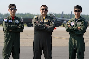 Republic of Korea Air Force Capt. Taemin Koo, left, F-16 pilot, U.S. Air Force Lt. Col. Nathan “Yaki” Mondul, center, 18th Fighter Interceptor Squadron commander, and a Japan Air Self-Defense Force F-15 pilot, pose for a photo during Red Flag-Alaska 25-2 at Eielson Air Force Base, Alaska, June 20, 2025.