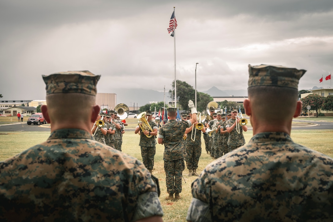 U.S. Marines with the Marine Corps Forces, Pacific Band, perform in Headquarters Battalion’s change of command ceremony at Marine Corps Base Hawaii, June 18, 2025. Lt. Col. Parker Consaul relinquished command to Lt. Col. Andrew Koch. (U.S. Marine Corps photo by Cpl. Dezmond Browning)