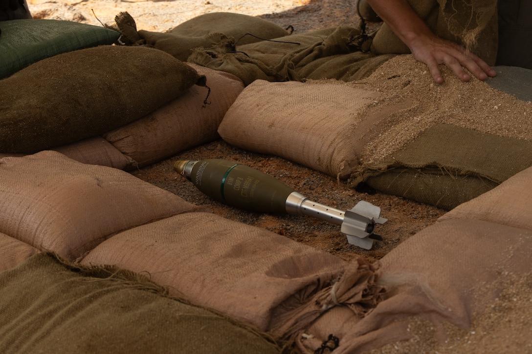 An 81mm mortar round lines on the ground during an explosive ordnance disposal training exercise on Camp Hansen, Okinawa, Japan, June 17, 2025. The purpose of this exercise was to help enhance the EOD section’s ability to conduct inerting and exploitation operations. (U.S. Marine Corps photo by Lance Cpl. Joseph Kreis)