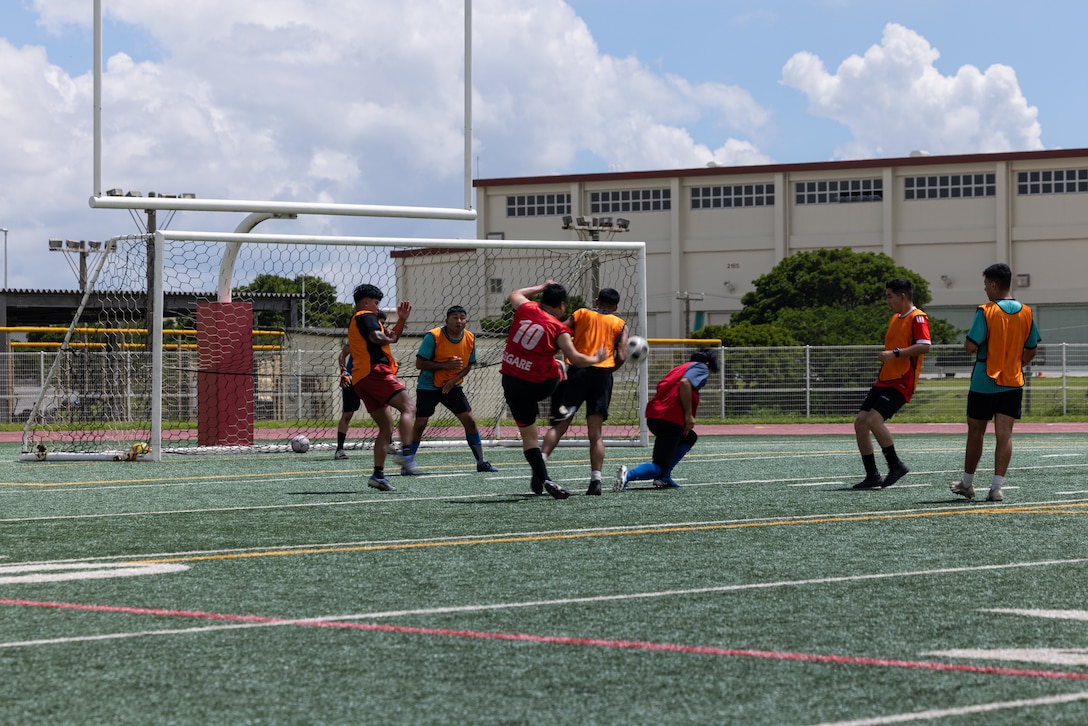 U.S. Marines from Camp Hansen, members of the Bushido Warriors, and members of Futsal Circle Legare compete during the Friendship Soccer Game on Camp Hansen, Okinawa, Japan, June 7, 2025. The event brought Marines and local residents together to foster a lasting relationships through friendly competition. Both the Bushido Warriors and Futsal Circle Legare compete in soccer tournaments across the island. (U.S. Marine Corps photo by Cpl. Jesse Davis)